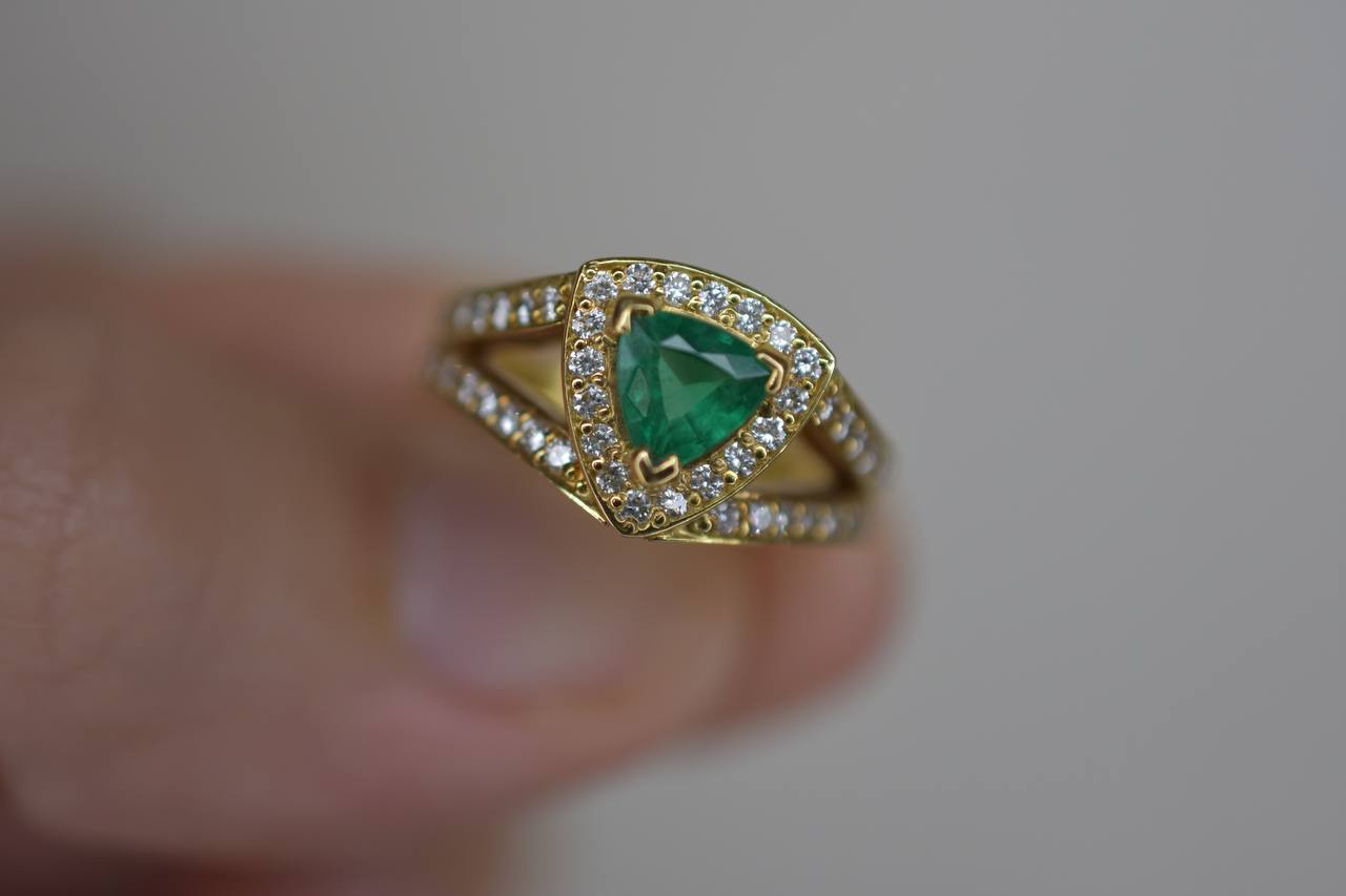 18ct Emerald ring with Diamond halo.