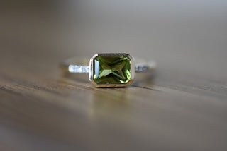 Peridot and diamond set ring