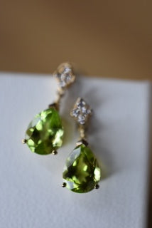 Peridot and Diamond set moving earrings with backings.
