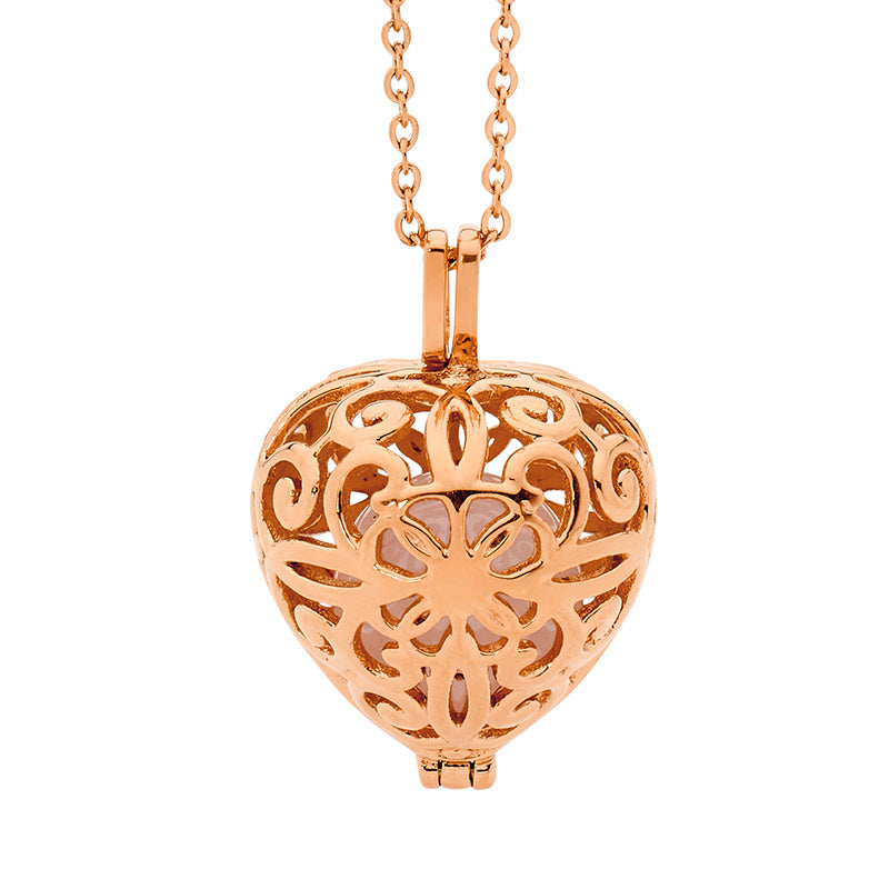 Stainless steel, rose gold plated, opening filligree heart with loose Rose Quartz